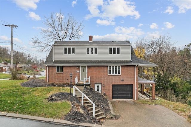 front of property with a front yard and a garage