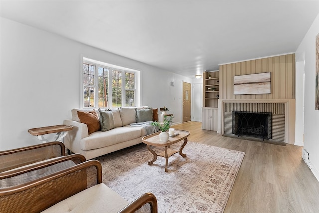 living room featuring a fireplace and light hardwood / wood-style floors