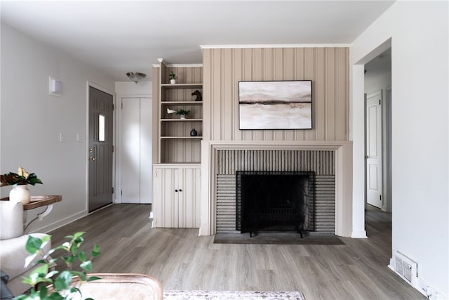 unfurnished living room with wood-type flooring