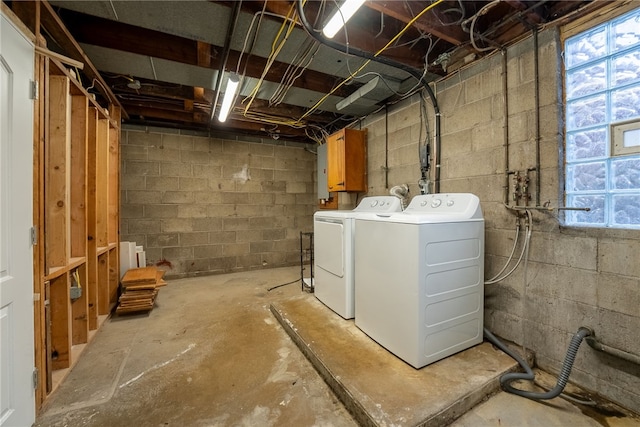 basement featuring washing machine and clothes dryer