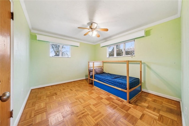 bedroom featuring ceiling fan, ornamental molding, and parquet flooring