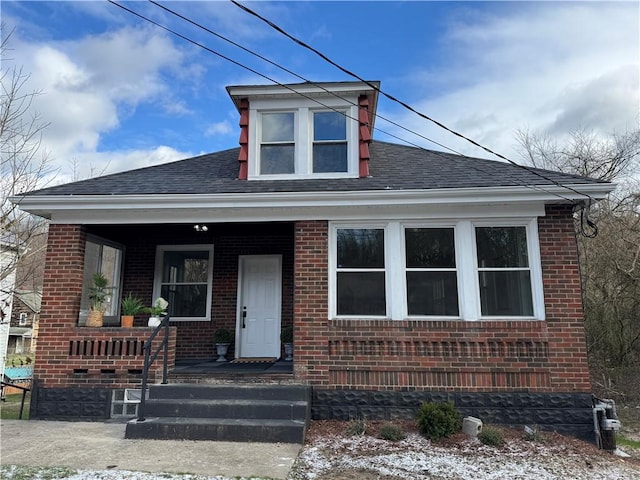 bungalow-style house featuring covered porch