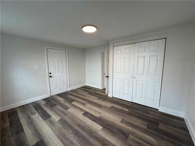 unfurnished bedroom featuring dark wood-type flooring