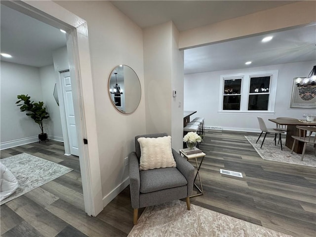 sitting room featuring dark hardwood / wood-style flooring