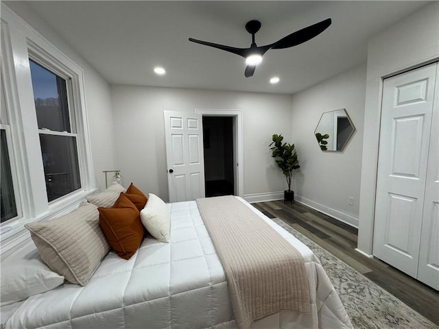 bedroom with ceiling fan and dark wood-type flooring