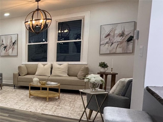 living room featuring hardwood / wood-style floors and an inviting chandelier