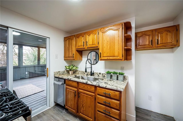 kitchen with black range with gas stovetop, sink, stainless steel dishwasher, light hardwood / wood-style floors, and light stone counters