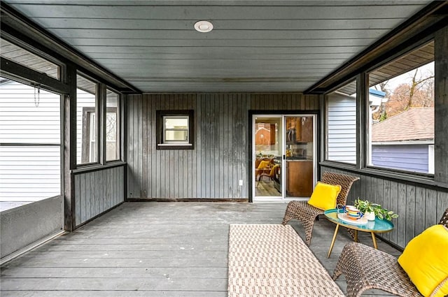 unfurnished sunroom with wood ceiling