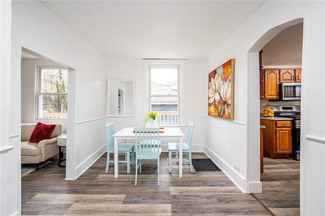 dining space with light hardwood / wood-style floors