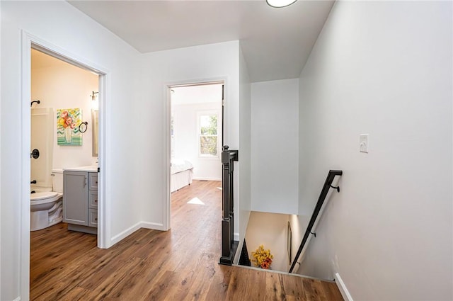 hallway featuring wood-type flooring