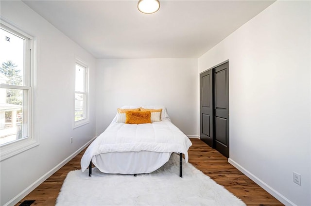 bedroom featuring dark wood-type flooring