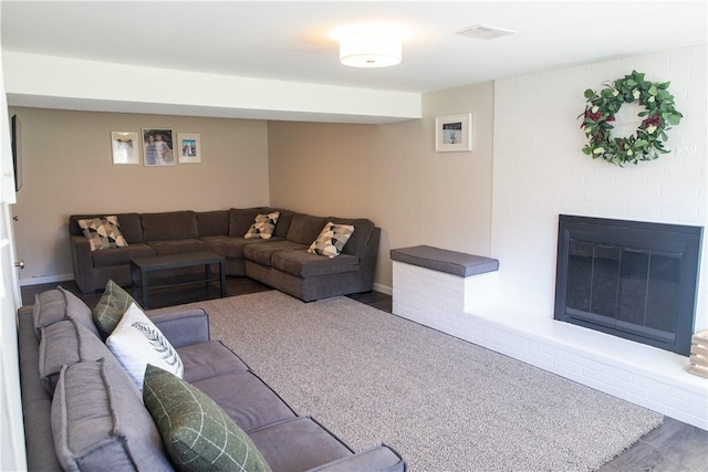 living room featuring hardwood / wood-style floors and a fireplace