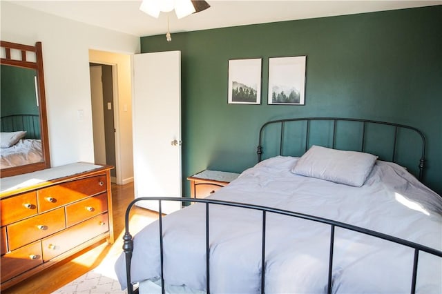 bedroom featuring ceiling fan and hardwood / wood-style floors