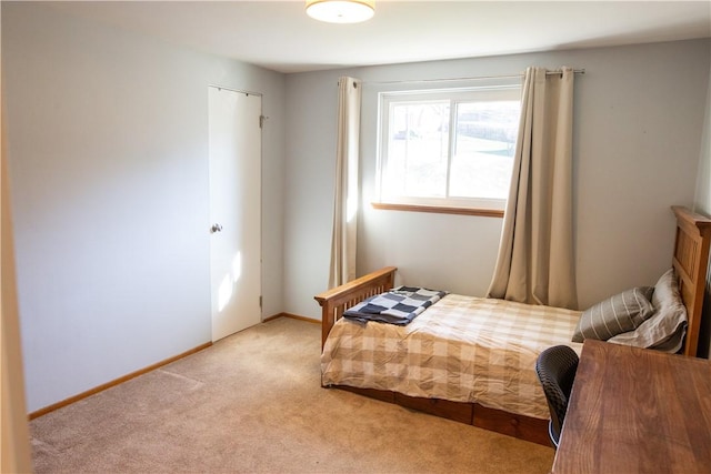 bedroom featuring light carpet