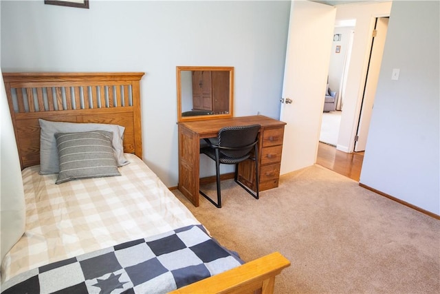 bedroom featuring light colored carpet