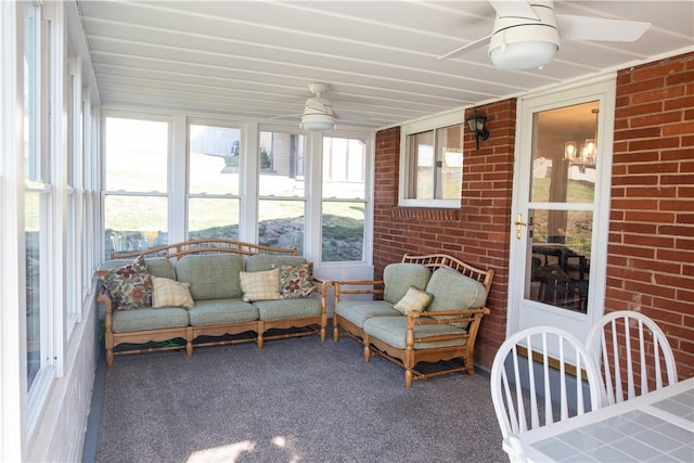 sunroom / solarium with ceiling fan