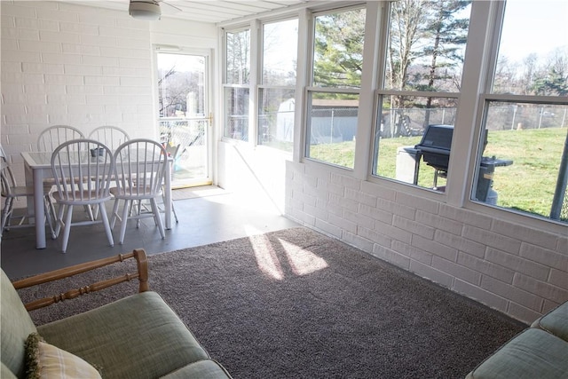 sunroom / solarium with ceiling fan