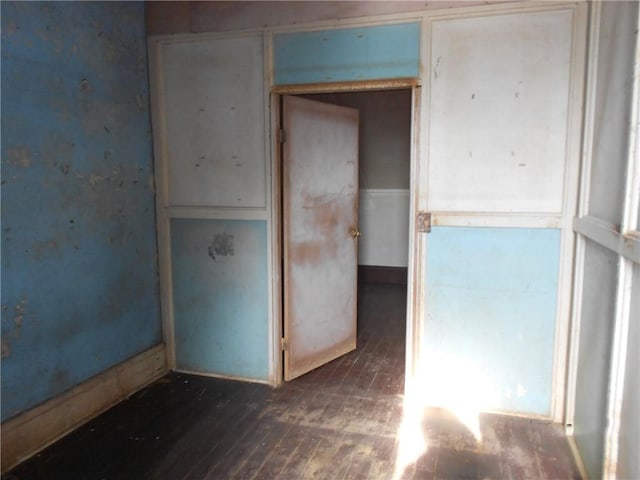 spare room featuring dark hardwood / wood-style flooring