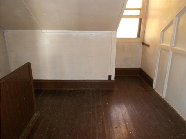 bonus room with dark wood-type flooring