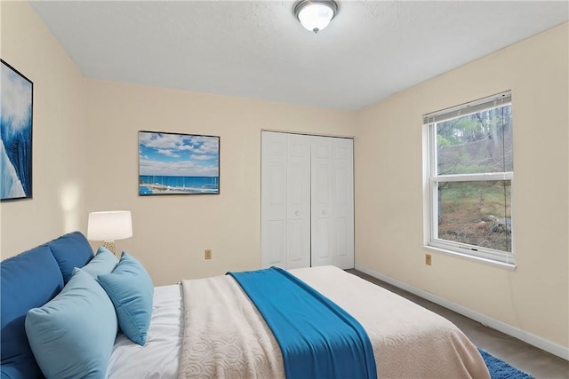 carpeted bedroom with a closet