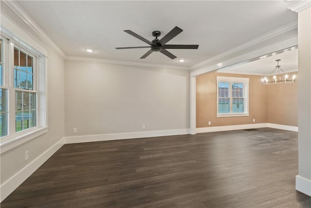 spare room featuring ceiling fan with notable chandelier, dark hardwood / wood-style floors, and crown molding