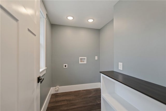 washroom featuring hookup for an electric dryer, dark hardwood / wood-style floors, and hookup for a washing machine