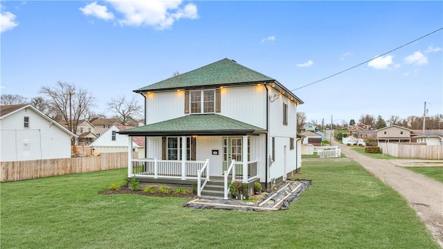 view of front facade featuring a porch and a front lawn