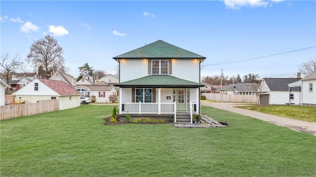 view of front of property with a front yard and a porch