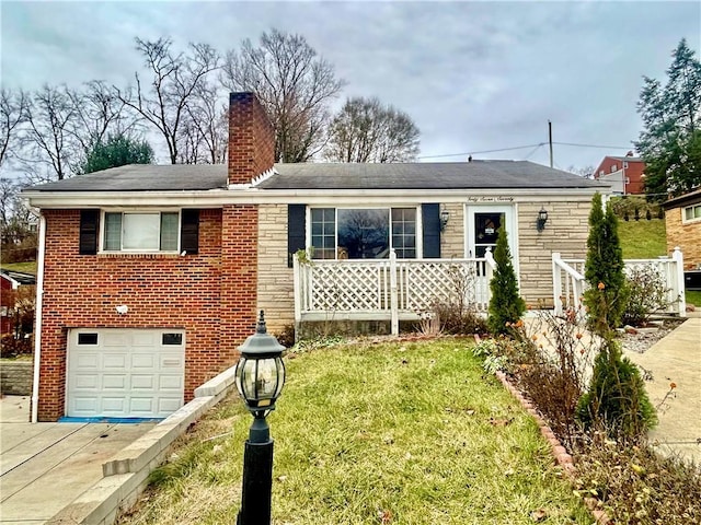 single story home with a front yard and a garage