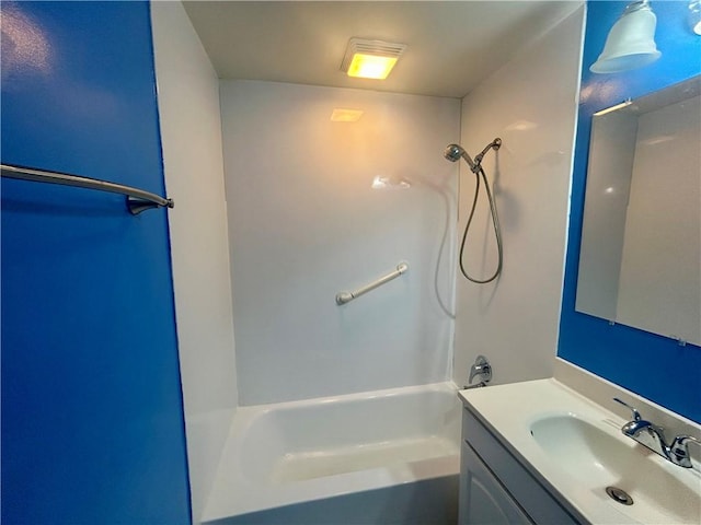 bathroom with vanity and washtub / shower combination