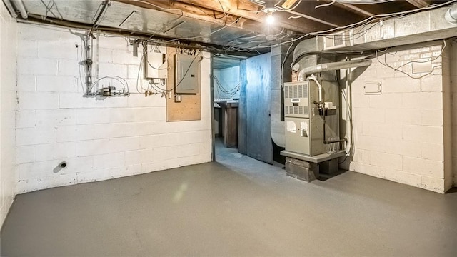 basement with electric panel and heating unit