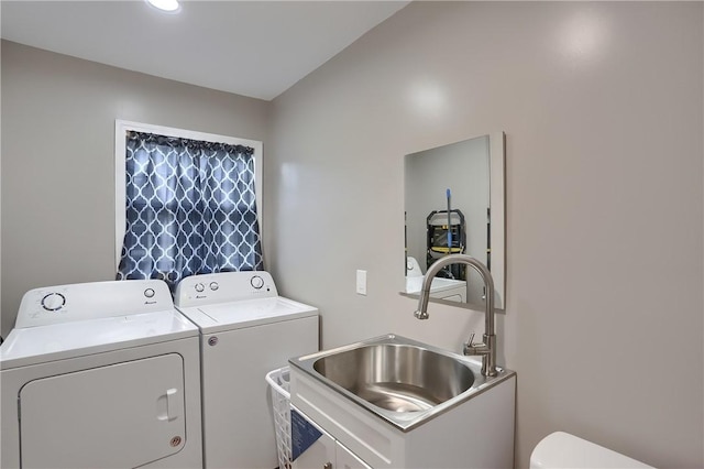 laundry room with washer and clothes dryer and sink