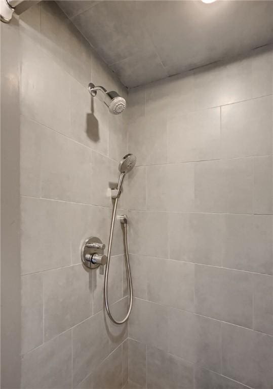 room details with a tile shower