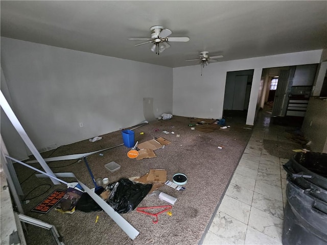 unfurnished living room featuring ceiling fan