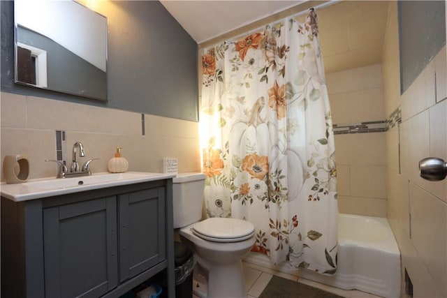 full bathroom with decorative backsplash, shower / bath combo, vanity, tile walls, and toilet