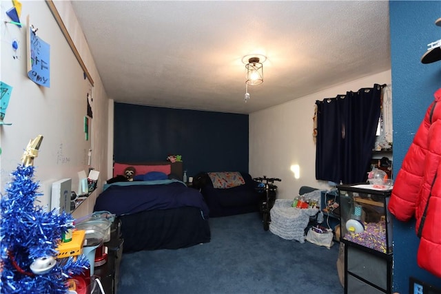 carpeted bedroom featuring a textured ceiling