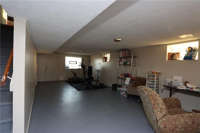 exercise room featuring a textured ceiling