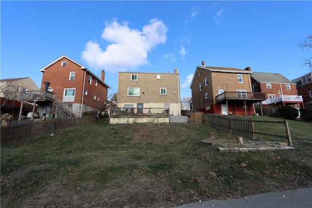 back of property featuring a yard