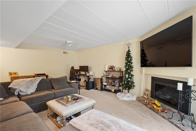 living room with light colored carpet and ceiling fan