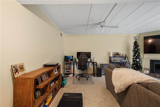 interior space with carpet and ceiling fan