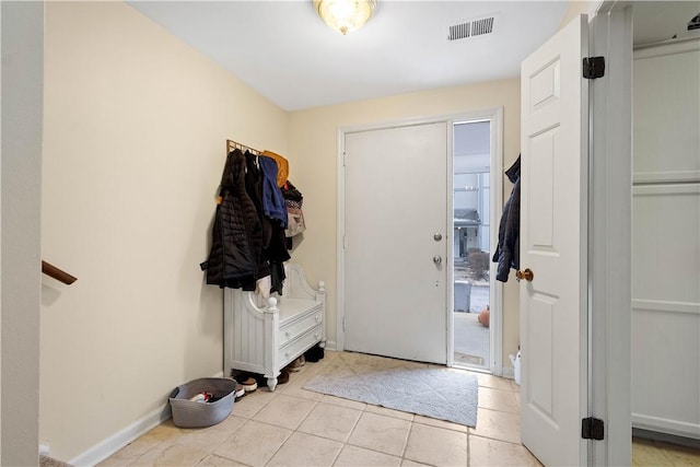 foyer with light tile patterned flooring