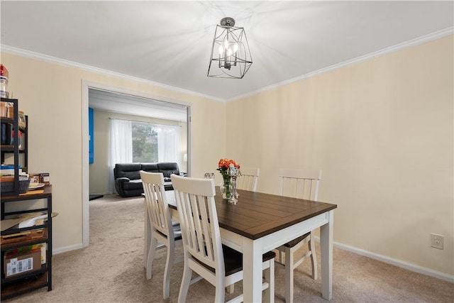 dining space with light colored carpet, crown molding, and an inviting chandelier