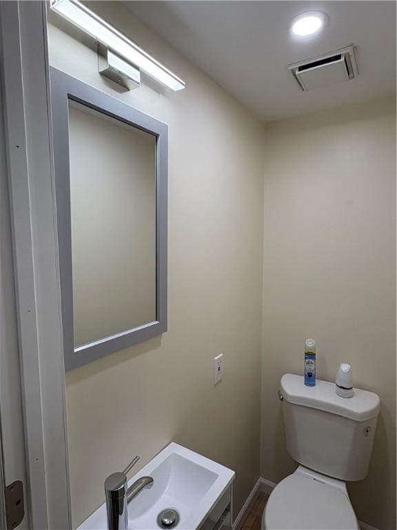 bathroom featuring sink and toilet