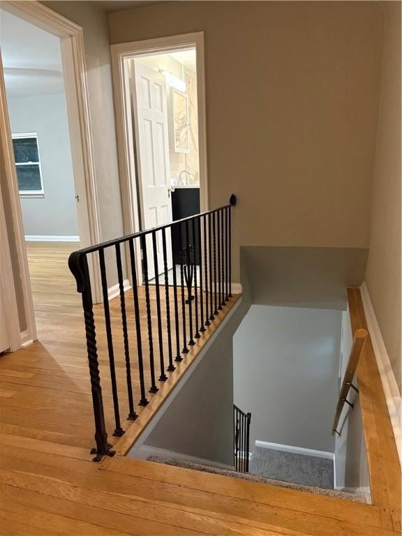 stairway featuring hardwood / wood-style floors