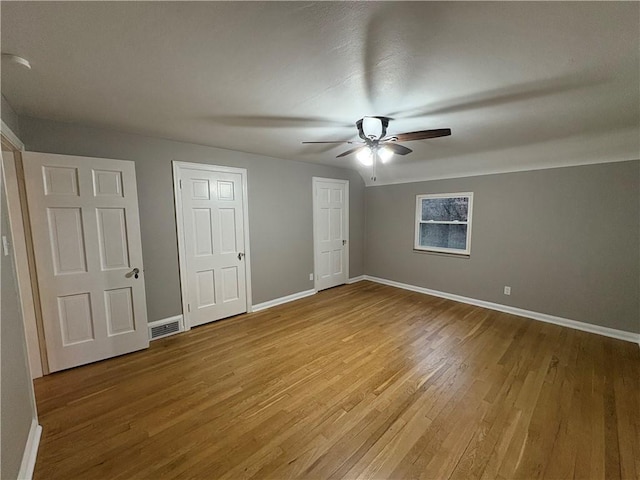 unfurnished bedroom with light hardwood / wood-style flooring and ceiling fan