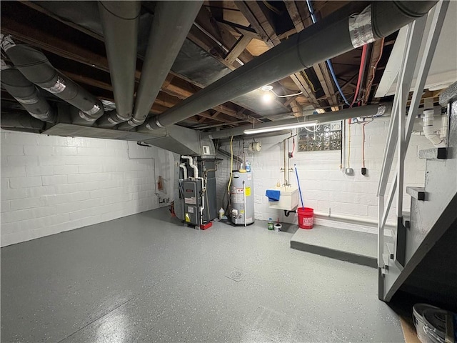 basement featuring gas water heater, sink, and heating unit