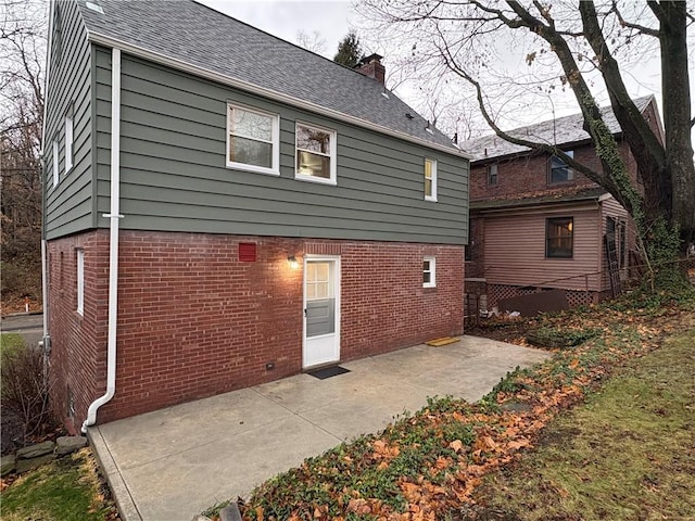 rear view of house featuring a patio