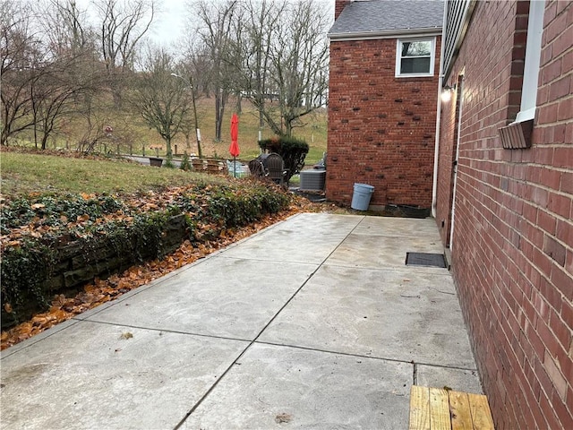 view of property exterior featuring a patio area and central air condition unit