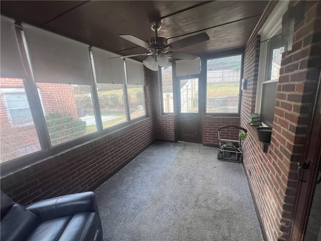 sunroom / solarium with ceiling fan