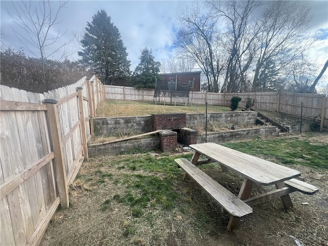 view of yard featuring a trampoline